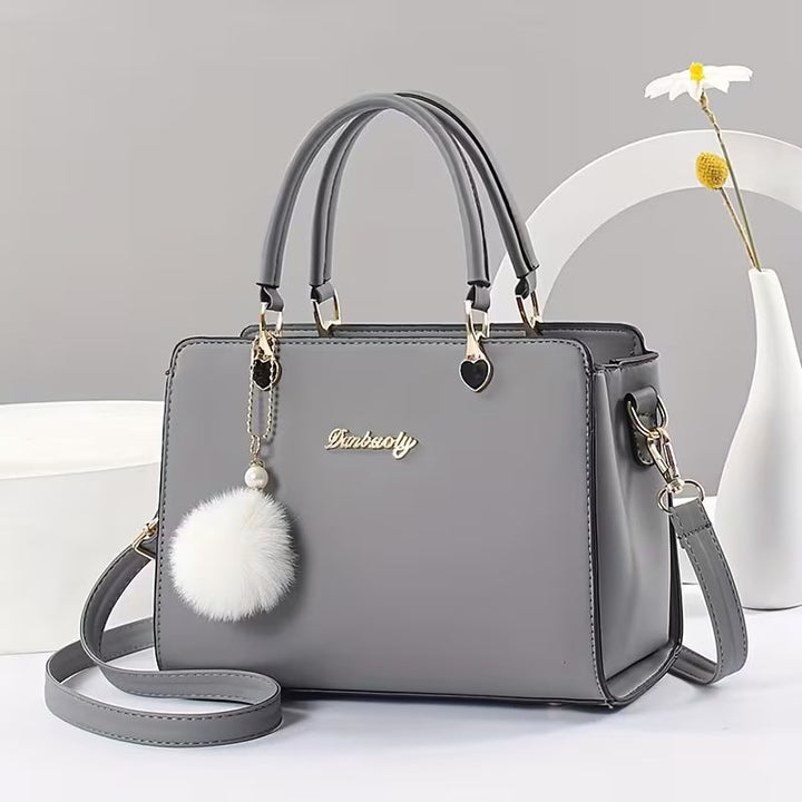 Sanika - Bolso de Mano Con Colgante de Pompón y Correa Para el Hombro